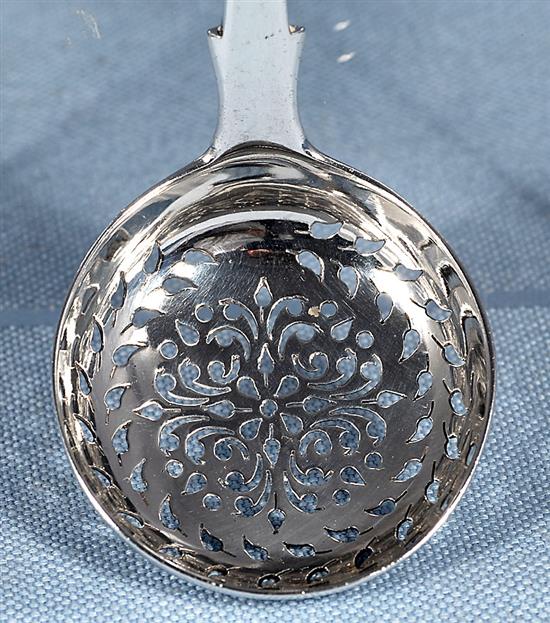 An early Victorian silver fiddle pattern sifter spoon, by John Harris IV & 2 others, 111 grams.